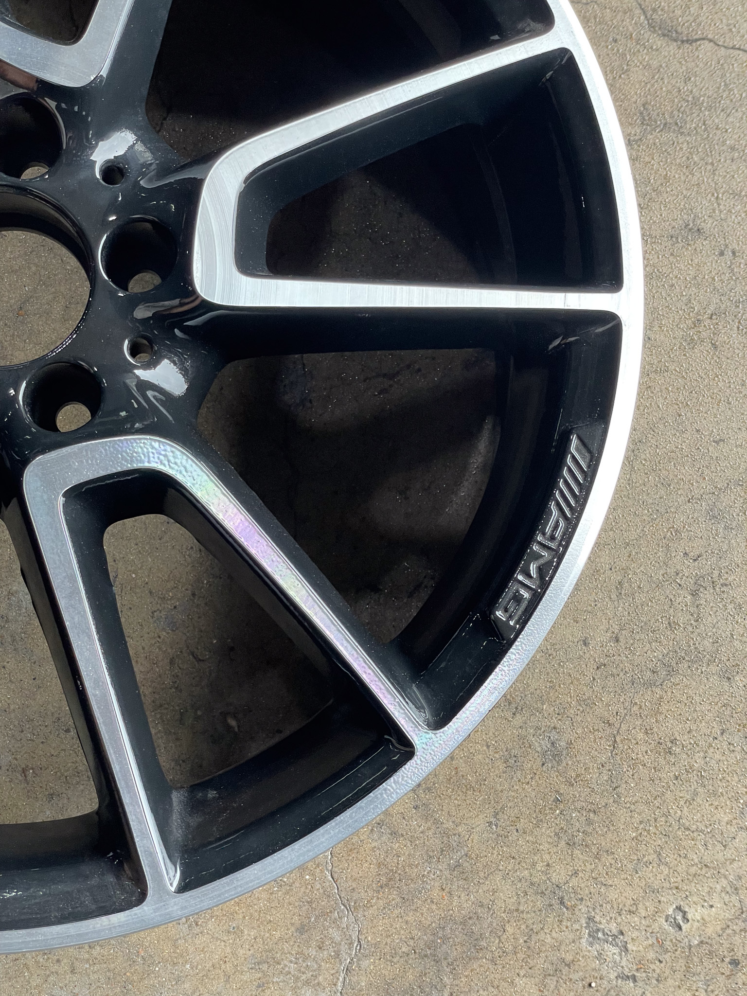 Image of a car wheel with no tire.